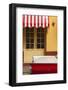 Cuba, Trinidad. Colorful Building and Striped Awning Compliment the Red Color of a Ford Fairlane-Brenda Tharp-Framed Photographic Print