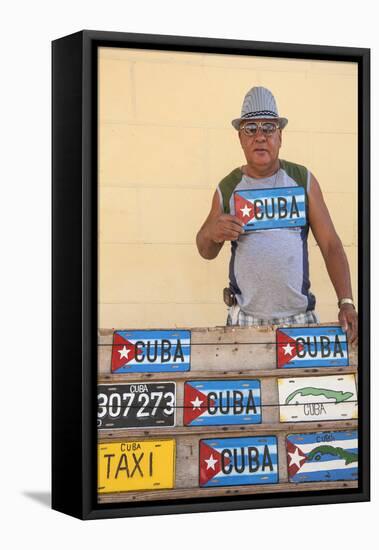 Cuba, Trinidad, Man Selling Cuban Car Number Plates-Jane Sweeney-Framed Stretched Canvas