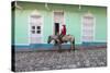 Cuba, Trinidad, Milkman on Horseback Delivers Bottles of Milk to House-Jane Sweeney-Stretched Canvas