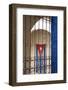 Cuba, Vinales, Cuban flag in courtyard and wrought iron gate.-Merrill Images-Framed Photographic Print