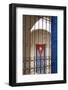 Cuba, Vinales, Cuban flag in courtyard and wrought iron gate.-Merrill Images-Framed Photographic Print