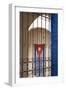 Cuba, Vinales, Cuban flag in courtyard and wrought iron gate.-Merrill Images-Framed Photographic Print
