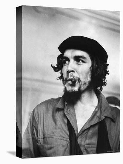 Cuban Rebel Ernesto "Che" Guevara with Lit Cigar Clenched Between Teeth and Left Arm in a Sling-Joe Scherschel-Stretched Canvas