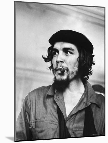 Cuban Rebel Ernesto "Che" Guevara with Lit Cigar Clenched Between Teeth and Left Arm in a Sling-Joe Scherschel-Mounted Premium Photographic Print