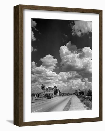 Cumulus Clouds Billowing over Texaco Gas Station along a Stretch of Highway US 66-Andreas Feininger-Framed Photographic Print