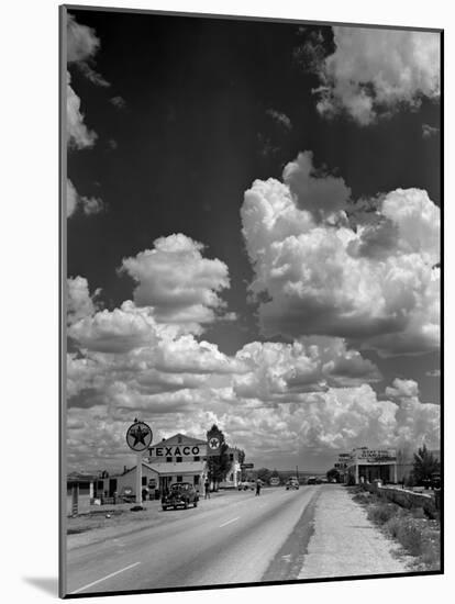 Cumulus Clouds Billowing over Texaco Gas Station along a Stretch of Highway US 66-Andreas Feininger-Mounted Photographic Print