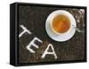 Cup of Black Tea, Surrounded by Tea Leaves with the Word Tea-null-Framed Stretched Canvas