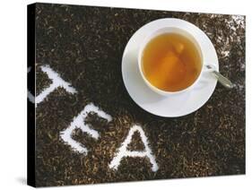 Cup of Black Tea, Surrounded by Tea Leaves with the Word Tea-null-Stretched Canvas