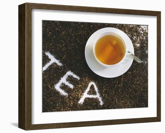 Cup of Black Tea, Surrounded by Tea Leaves with the Word Tea-null-Framed Photographic Print