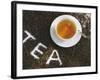 Cup of Black Tea, Surrounded by Tea Leaves with the Word Tea-null-Framed Photographic Print