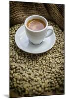 Cup of Espresso on a Sack with Unroasted Coffee Beans-Bernd Wittelsbach-Mounted Photographic Print