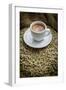 Cup of Espresso on a Sack with Unroasted Coffee Beans-Bernd Wittelsbach-Framed Photographic Print