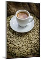 Cup of Espresso on a Sack with Unroasted Coffee Beans-Bernd Wittelsbach-Mounted Photographic Print