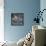 Curious Girl Looking at a Toy Chicken Head Toy by Charles Eames-Allan Grant-Framed Stretched Canvas displayed on a wall