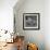 Curious Girl Looking at a Toy Chicken Head Toy by Charles Eames-Allan Grant-Framed Photographic Print displayed on a wall