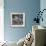 Curious Girl Looking at a Toy Chicken Head Toy by Charles Eames-Allan Grant-Framed Photographic Print displayed on a wall