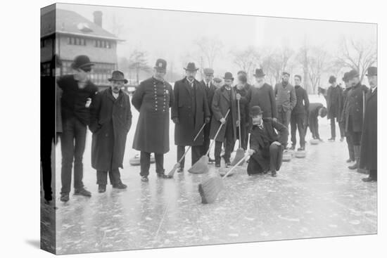 Curling in Central Park with Men Having Brooms at the Ready over the Ice.-null-Stretched Canvas