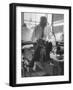 Custom Tailor Ernest Preedik Sitting on Table and Working in Factory-Ralph Morse-Framed Photographic Print