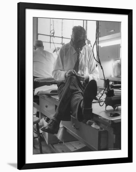 Custom Tailor Ernest Preedik Sitting on Table and Working in Factory-Ralph Morse-Framed Photographic Print