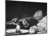 Customer Smoking Opium in an Opium Den-George Lacks-Mounted Photographic Print