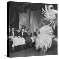 Customers at Sally Rand's Nightclub Watching a Dancer Performing the Midnight Fan Dance-Charles E^ Steinheimer-Stretched Canvas
