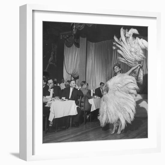 Customers at Sally Rand's Nightclub Watching a Dancer Performing the Midnight Fan Dance-Charles E^ Steinheimer-Framed Premium Photographic Print