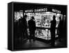 Customers Peering at the Wares Inside a Small, Brightly Lit Times Square Jewelry and Watch Shop-Peter Stackpole-Framed Stretched Canvas
