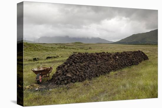 Cut Peat Stacked up for Winter, Connemara, County Galway, Connacht, Republic of Ireland-Gary Cook-Stretched Canvas