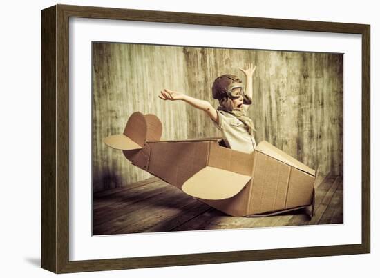 Cute Dreamer Boy Playing with a Cardboard Airplane. Childhood. Fantasy, Imagination. Retro Style.-prometeus-Framed Photographic Print