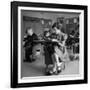 Cute Little Girl Busily at Work, Sitting in a Desk Chair in a Schoolroom, Other Pupils at Work Too-Gordon Parks-Framed Photographic Print