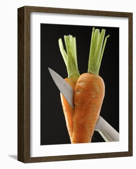 Cutting a Carrot in Half with a Knife-Vladimir Shulevsky-Framed Photographic Print