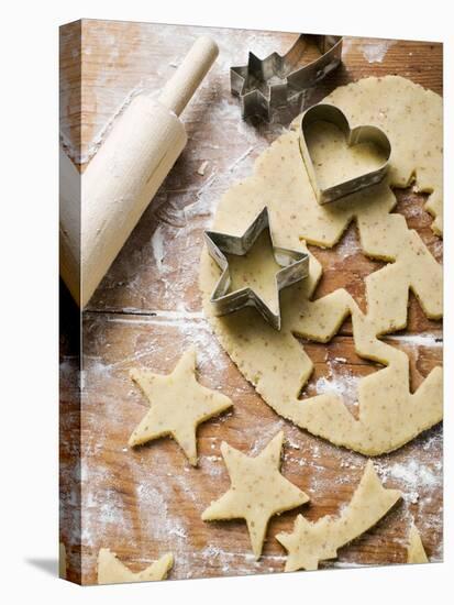 Cutting Out Heart-Shaped and Star-Shaped Biscuits-null-Stretched Canvas