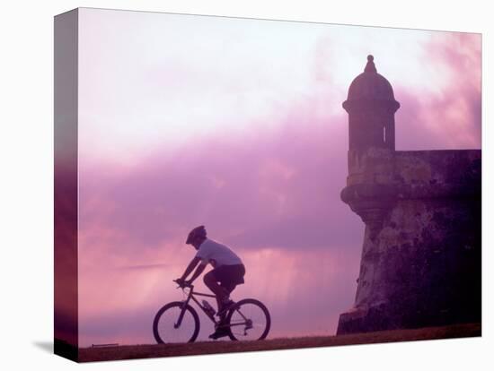 Cycling at El Morro in Old San Juan at Sunset, Puerto Rico-Greg Johnston-Stretched Canvas