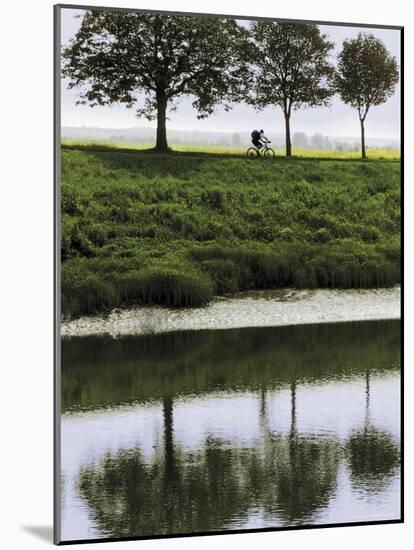 Cyclist on Banks of River Somme, St. Valery Sur Somme, Picardy, France-David Hughes-Mounted Photographic Print