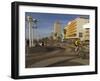 Cyclist on Jerusalem Beach Promenade with Dan Hotel Facade Decorated by Yaaqov Agam in Background-Eitan Simanor-Framed Photographic Print