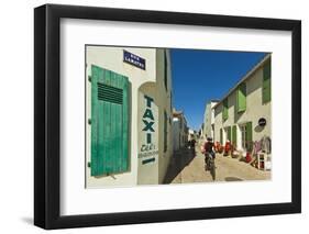 Cyclist on Rue Lamathe in the island's principal western town, Ars en Re, Ile de Re, Charente-Marit-Robert Francis-Framed Photographic Print