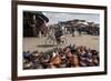 Cyclist Passing a Stall Selling Traditional Clay Tajine Cooking Pots in Place Jemaa El-Fna-Martin Child-Framed Photographic Print