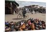 Cyclist Passing a Stall Selling Traditional Clay Tajine Cooking Pots in Place Jemaa El-Fna-Martin Child-Mounted Photographic Print