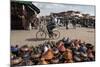 Cyclist Passing a Stall Selling Traditional Clay Tajine Cooking Pots in Place Jemaa El-Fna-Martin Child-Mounted Photographic Print