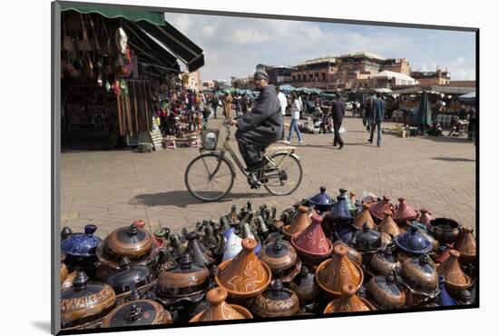 Cyclist Passing a Stall Selling Traditional Clay Tajine Cooking Pots in Place Jemaa El-Fna-Martin Child-Mounted Photographic Print