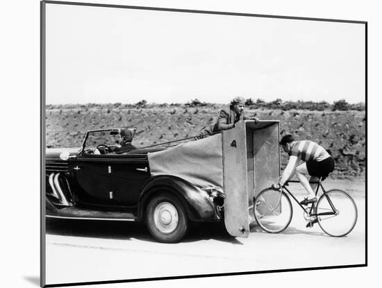 Cyclist Training Behind an Auburn Car, C1935-null-Mounted Photographic Print