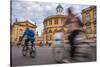 Cyclists Passing the Sheldonian Theatre, Oxford, Oxfordshire, England, United Kingdom, Europe-John Alexander-Stretched Canvas