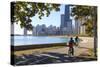 Cyclists Riding Along Lake Michigan Shore with the Chicago Skyline Beyond, Chicago, Illinois, USA-Amanda Hall-Stretched Canvas
