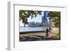 Cyclists Riding Along Lake Michigan Shore with the Chicago Skyline Beyond, Chicago, Illinois, USA-Amanda Hall-Framed Photographic Print