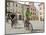 Cyclists Riding Through Namesti in Town of Mikulov, Brnensko Region-Richard Nebesky-Mounted Photographic Print