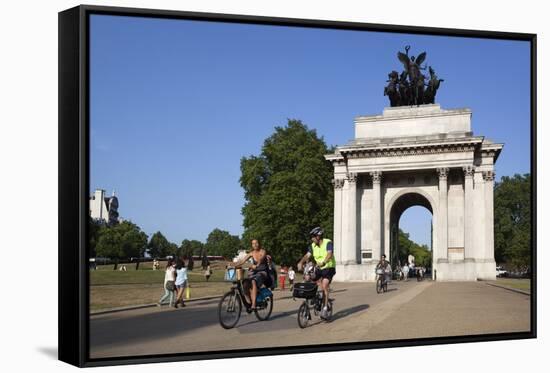 Cyclists under the Wellington Arch, Hyde Park Corner, London, England, United Kingdom, Europe-Stuart Black-Framed Stretched Canvas