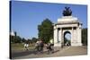 Cyclists under the Wellington Arch, Hyde Park Corner, London, England, United Kingdom, Europe-Stuart Black-Stretched Canvas