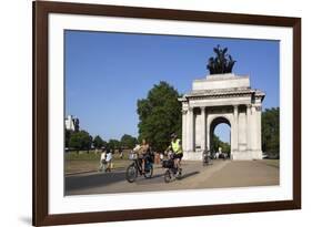 Cyclists under the Wellington Arch, Hyde Park Corner, London, England, United Kingdom, Europe-Stuart Black-Framed Photographic Print