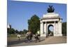 Cyclists under the Wellington Arch, Hyde Park Corner, London, England, United Kingdom, Europe-Stuart Black-Mounted Photographic Print