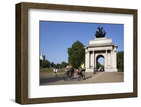 Cyclists under the Wellington Arch, Hyde Park Corner, London, England, United Kingdom, Europe-Stuart Black-Framed Photographic Print